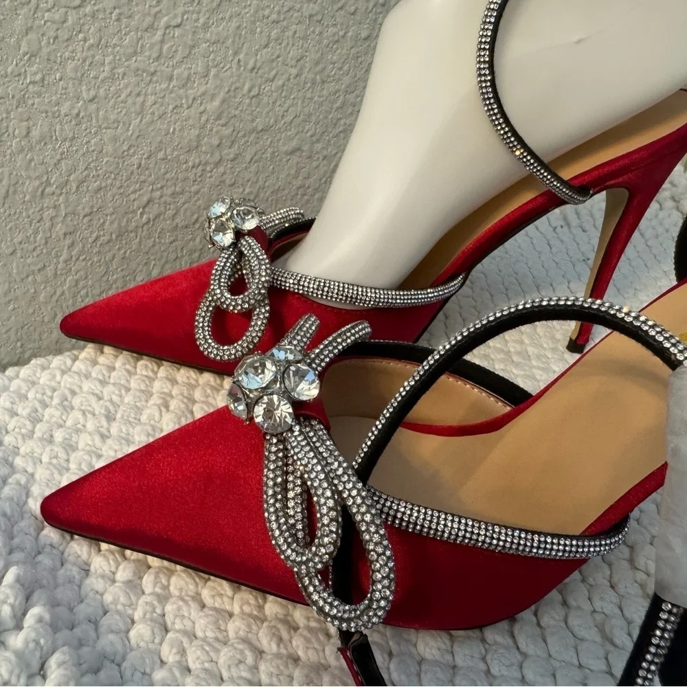 Elegant Red Stiletto Heels with Rhinestone Bow Accents
